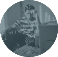 Photo of a person sitting with a hand on the forehead